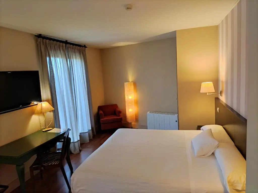 Hotel Puerta Del Arco - Chambres