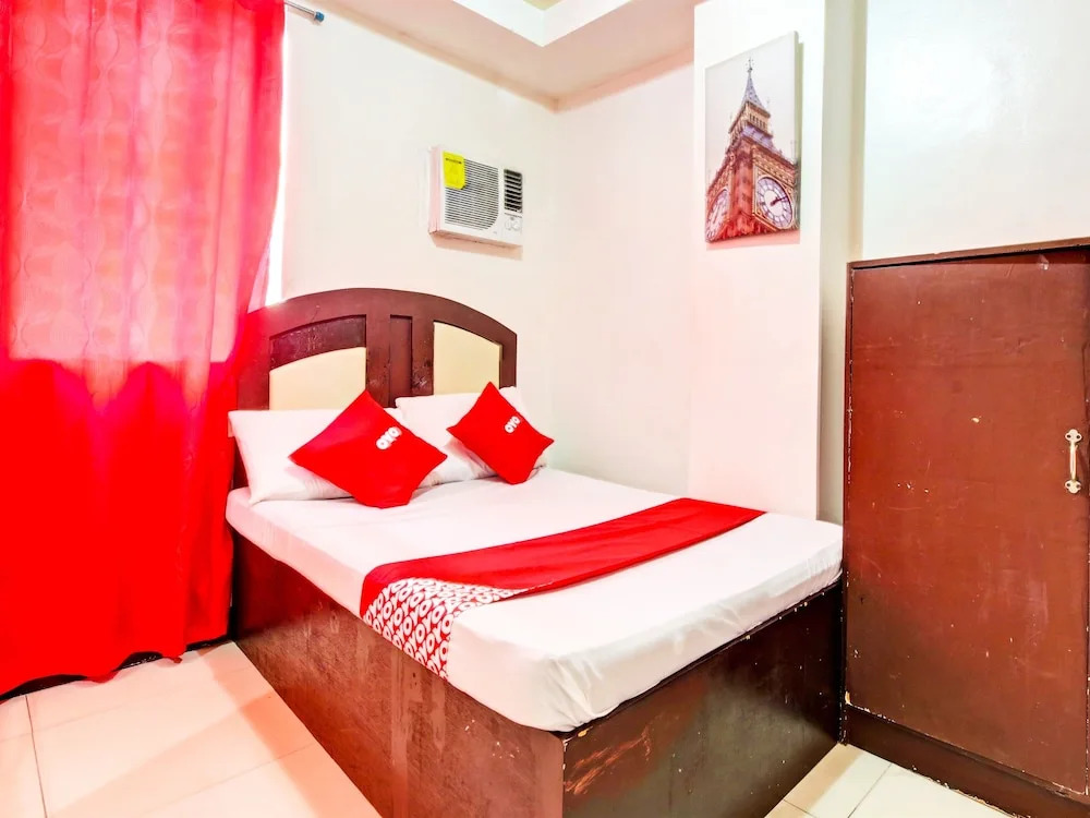 Четырёхместный семейный номер Standard 2 отдельные кровати в OYO 894 Cosmo Hotel P Campa Manila