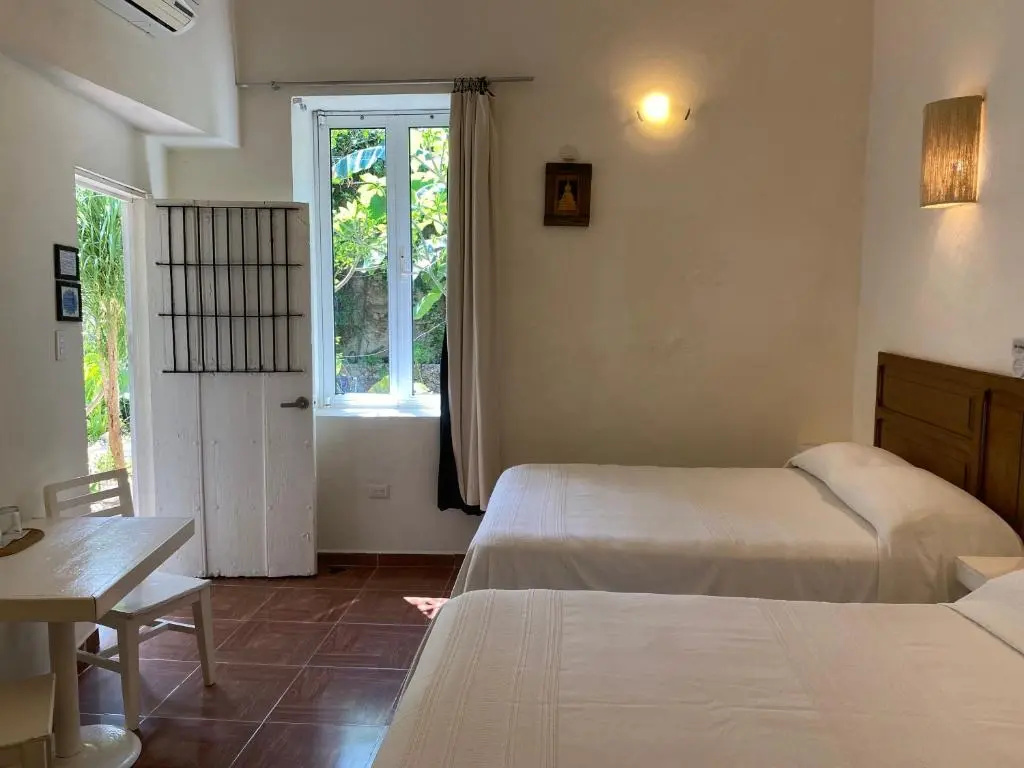 Standard Quadruple room with garden view