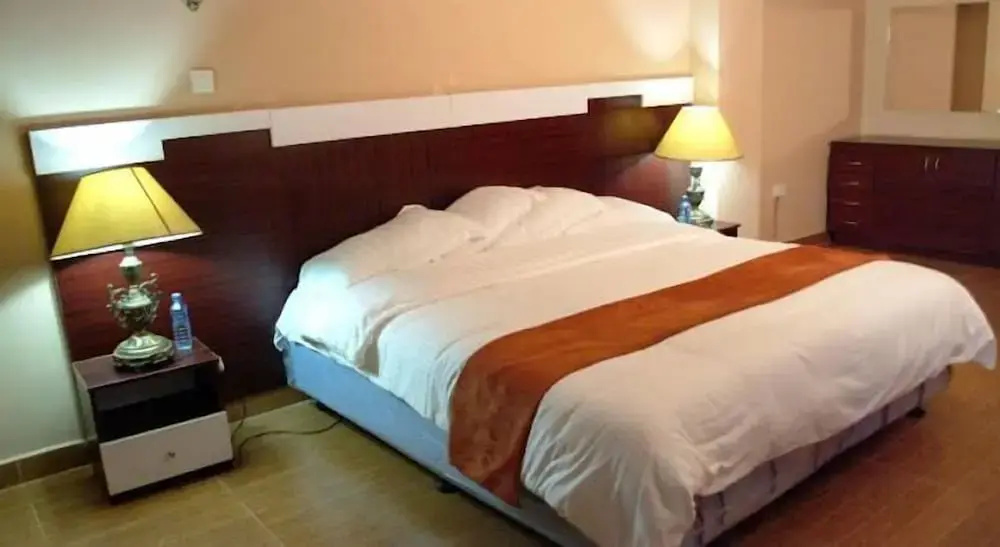 The Coconut Grill Hotel - Chambres