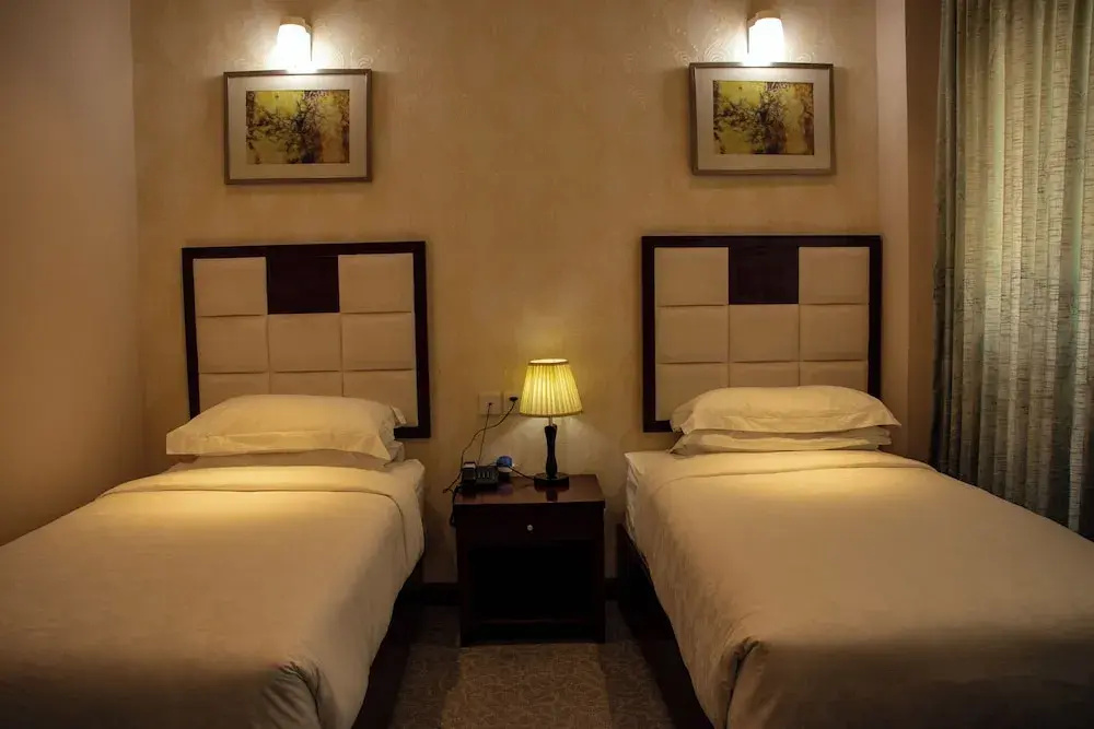 Ratna Hotel - Chambres