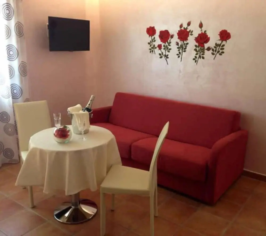 Deluxe Quadruple room with balcony and with garden view