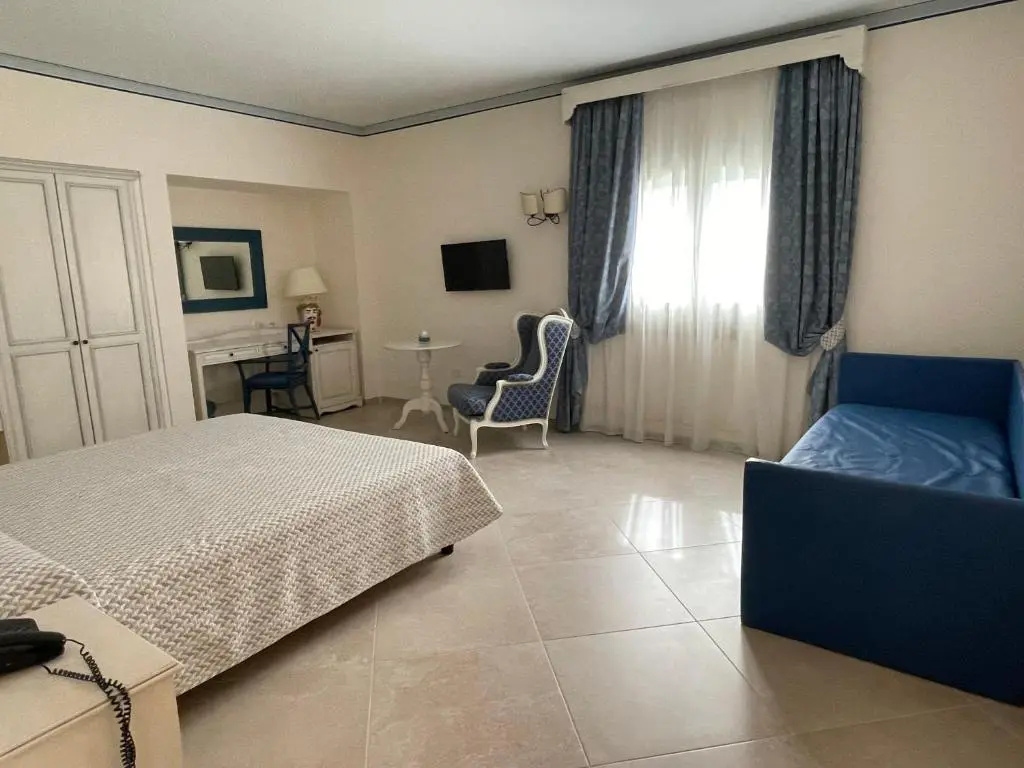 Standard Quadruple room with garden view