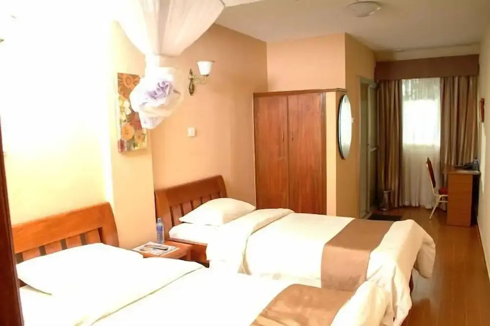 The Coconut Grill Hotel - Chambres