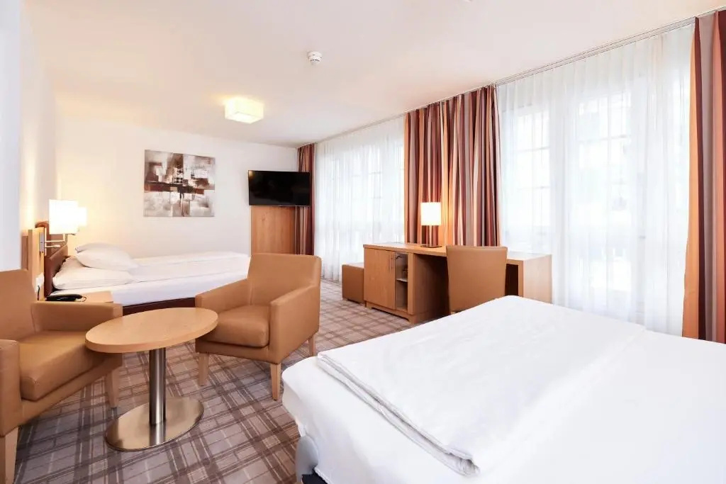 Central City Hotel Rochat - Chambres