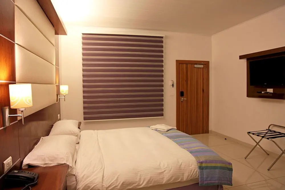 Double Suite with balcony and with pool view full double bed