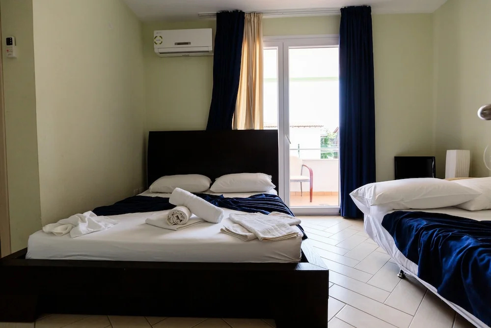 Standard Quadruple Family room with balcony and with partial sea view