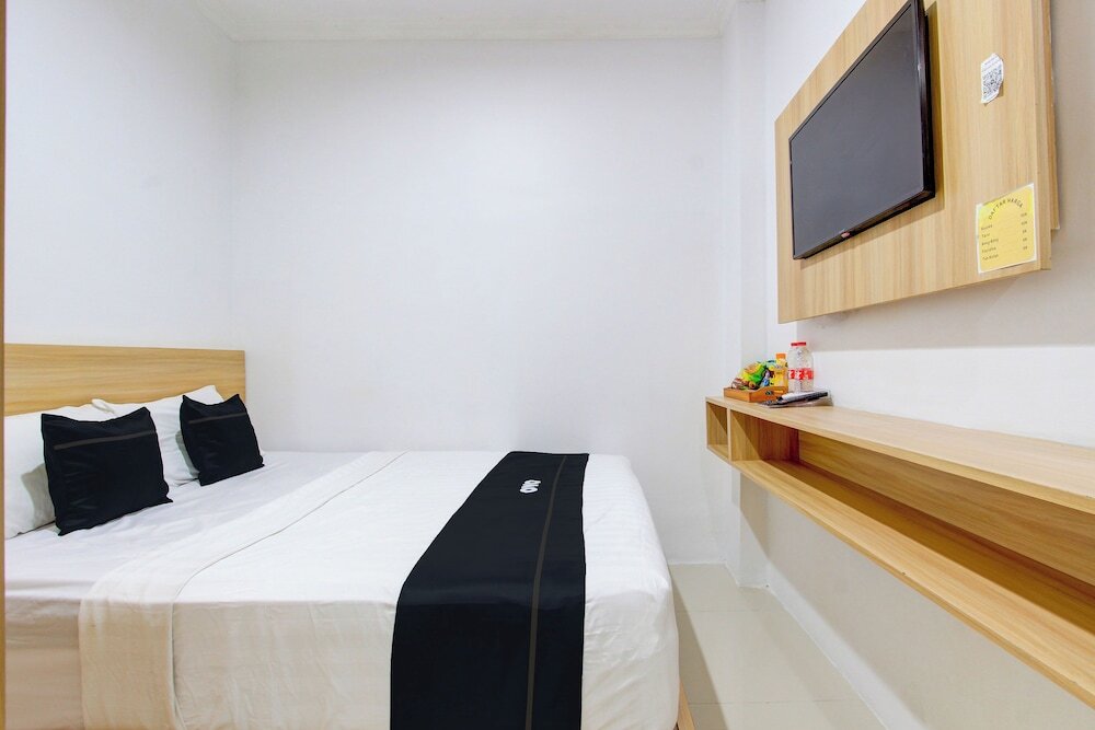Люкс Deluxe в Capital O 93266 Palmier Hotel