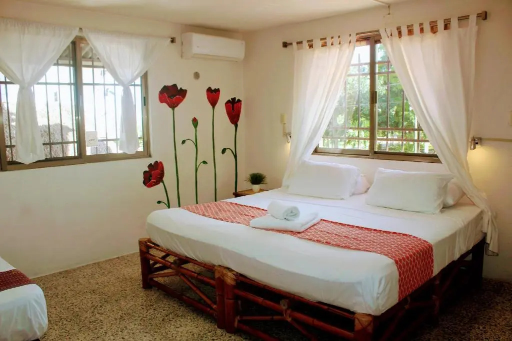 Hostal & Suites Pata de Perro - Chambres