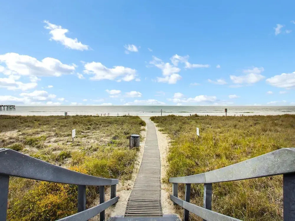 Oceanfront Beach Condo with Private Balcony, Short Walk to Pool and Beach by RedAwning