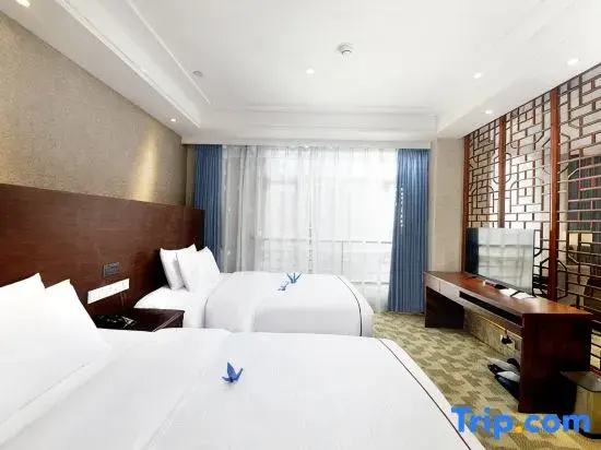 Harmonious Dunpu Hotel - Chambres