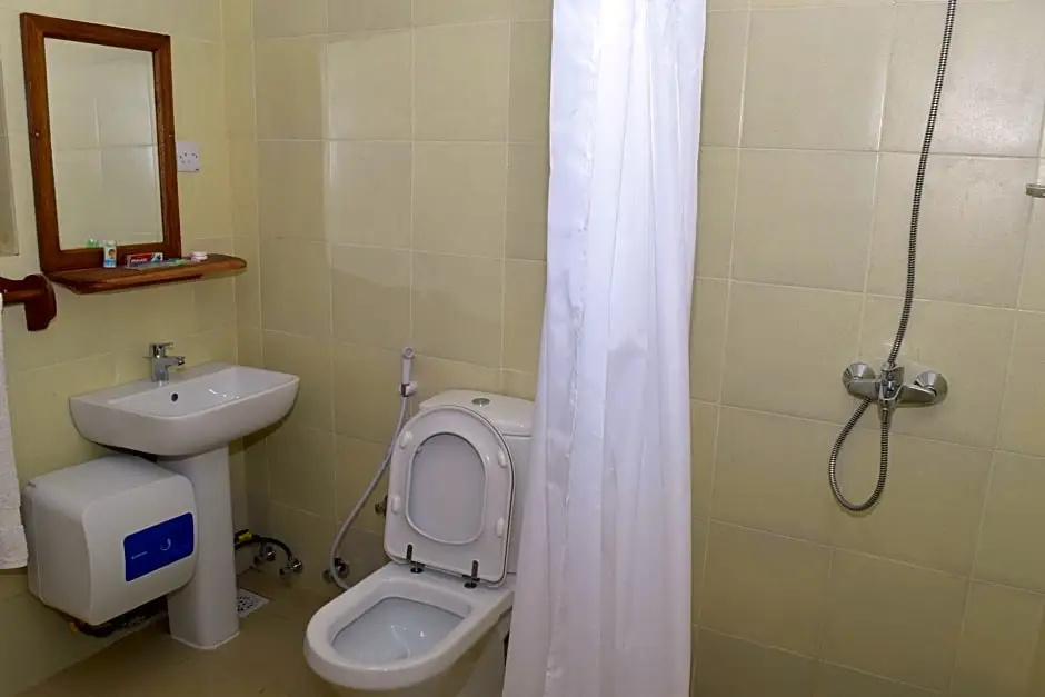 Chukwani Executive Inn - Chambres
