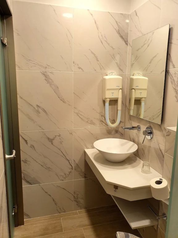 Caravel Apartment Hotel - Chambres