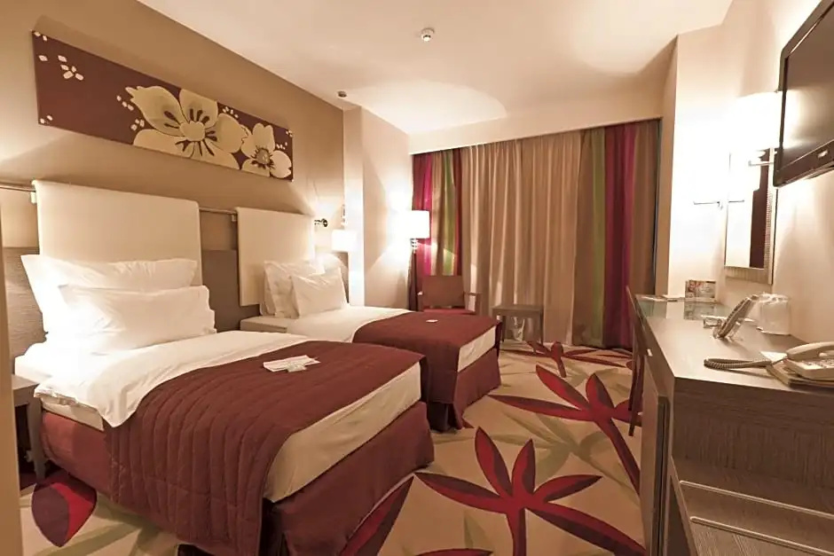 Golden Tulip Ana Dome - Chambres