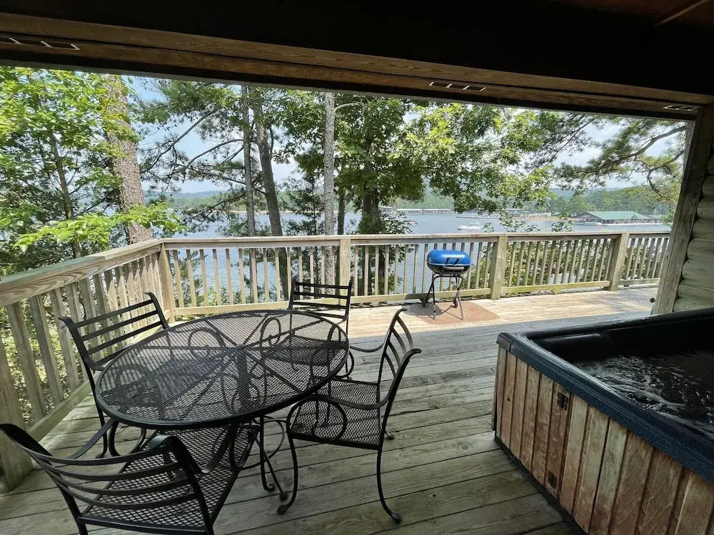 Lake view two bedroom, two bath loft, log-sided cottage with private hot tub overlooking Lake Ouachita. by RedAwning