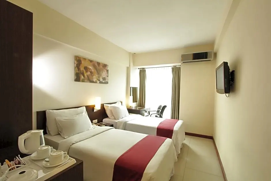 Garuda Plaza Hotel - Chambres