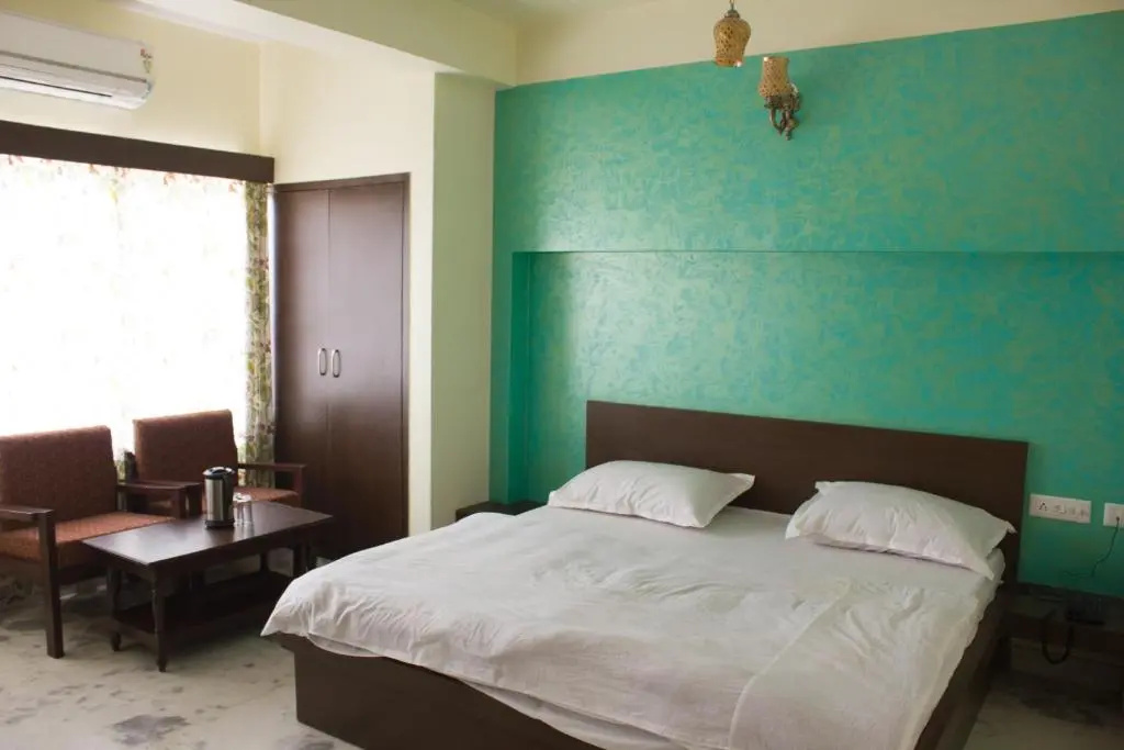 Hotel Holiday Home - Chambres