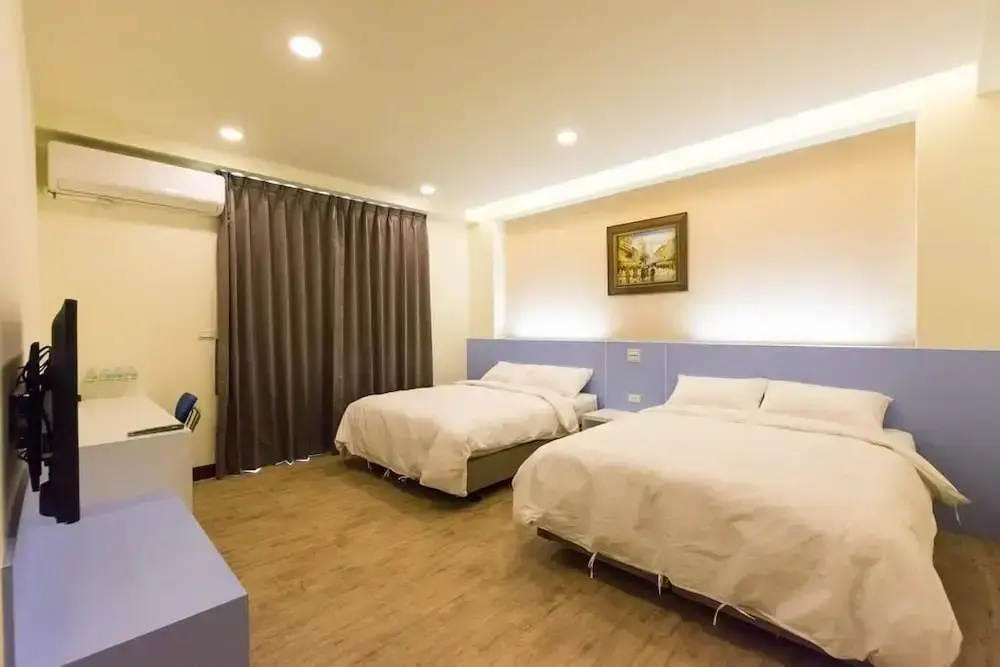Deluxe Quadruple room with balcony