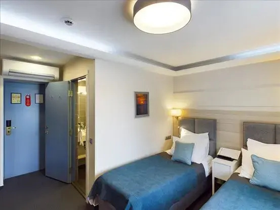 Amrita Hotel - Chambres