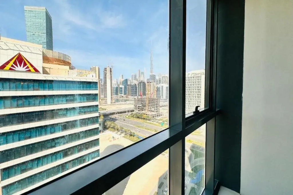 Upscale Studio Apartment Business Bay with Balcony and Free Parking by BelVilla