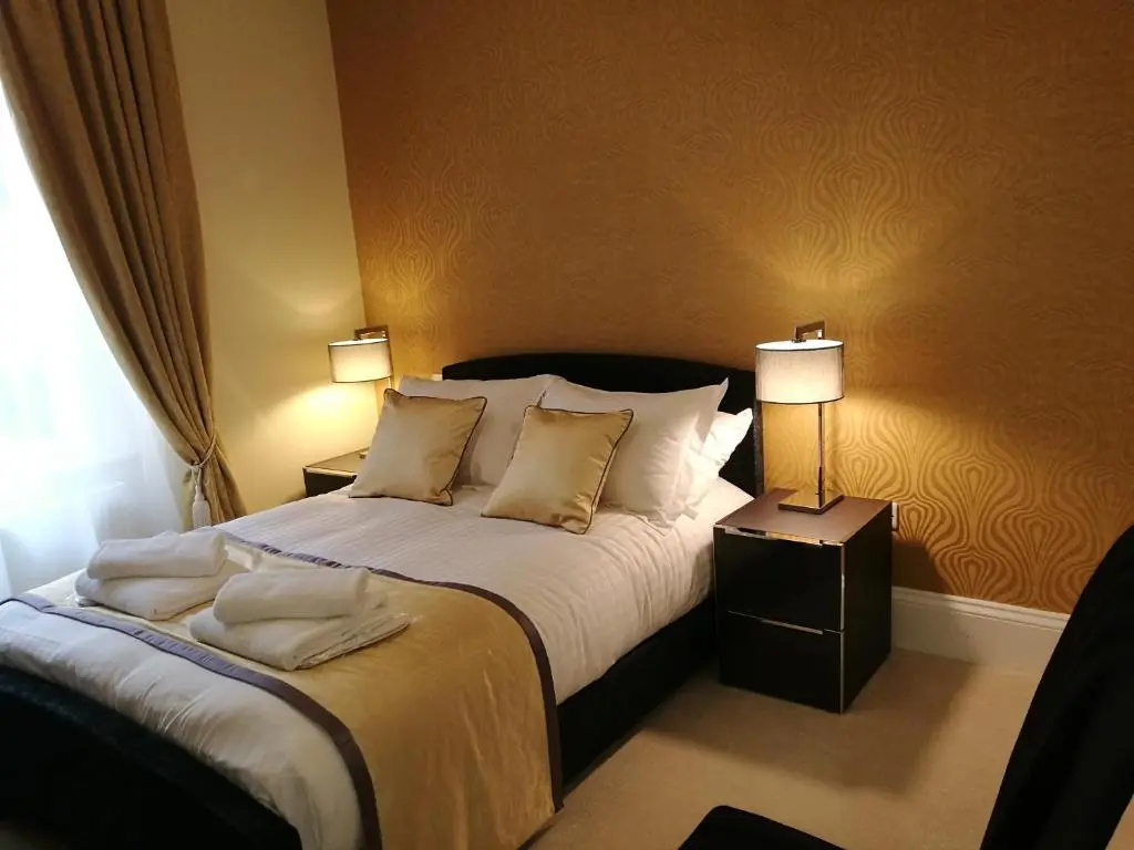 The Devon Court - Chambres