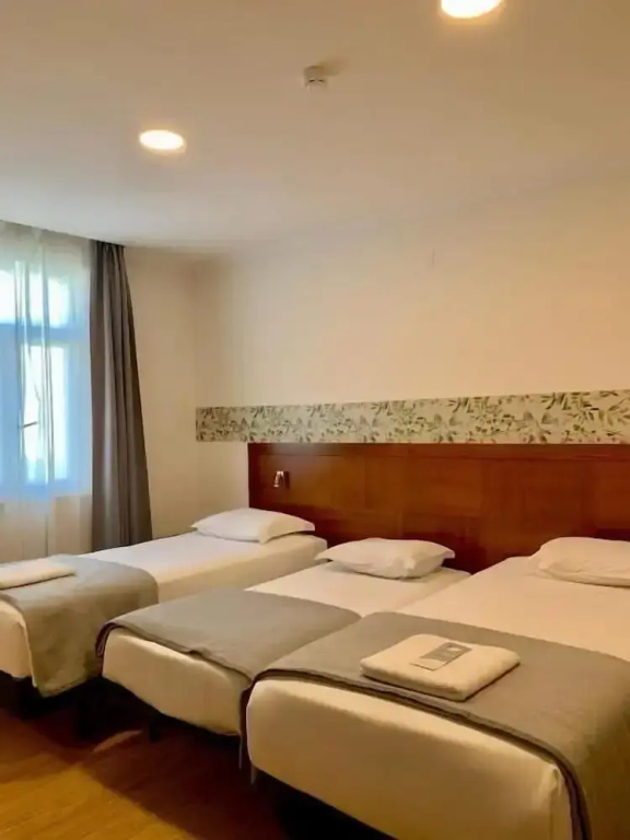 Superior Triple room with balcony and with city view