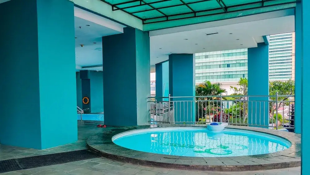 Comfortable 2BR Green Central City Apartment By Travelio