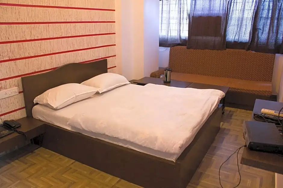 Hotel Holiday Home - Chambres