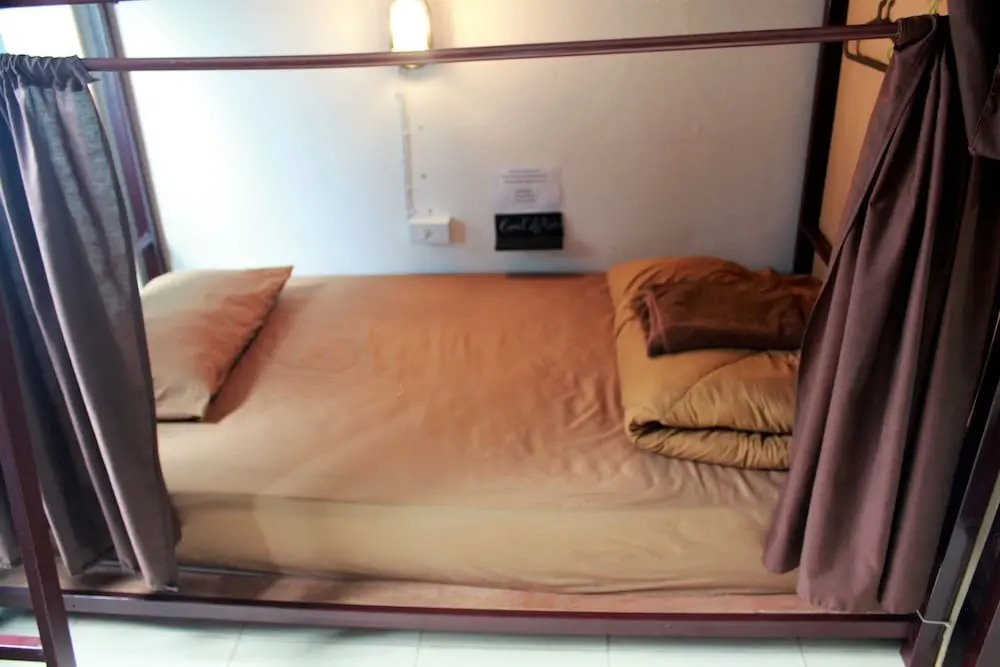 Кровать в общем номере в CM City Hostel