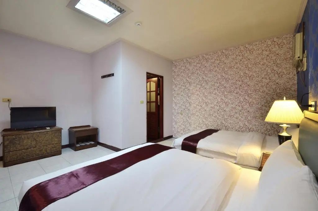 Jiuning Business Hotel - Chambres