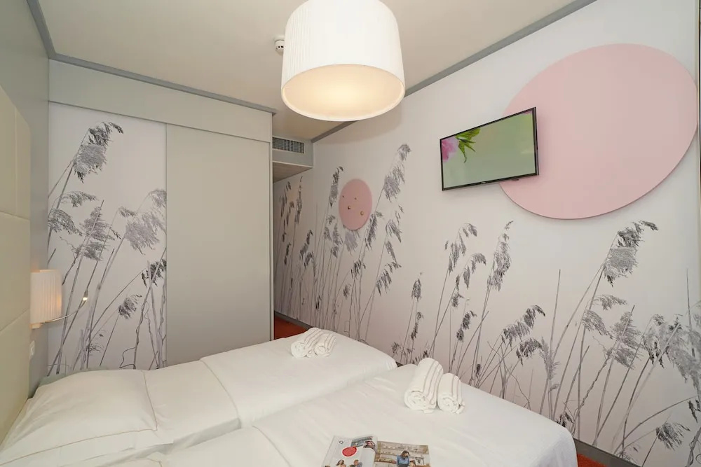 Bike Hotel La Perla - Chambres