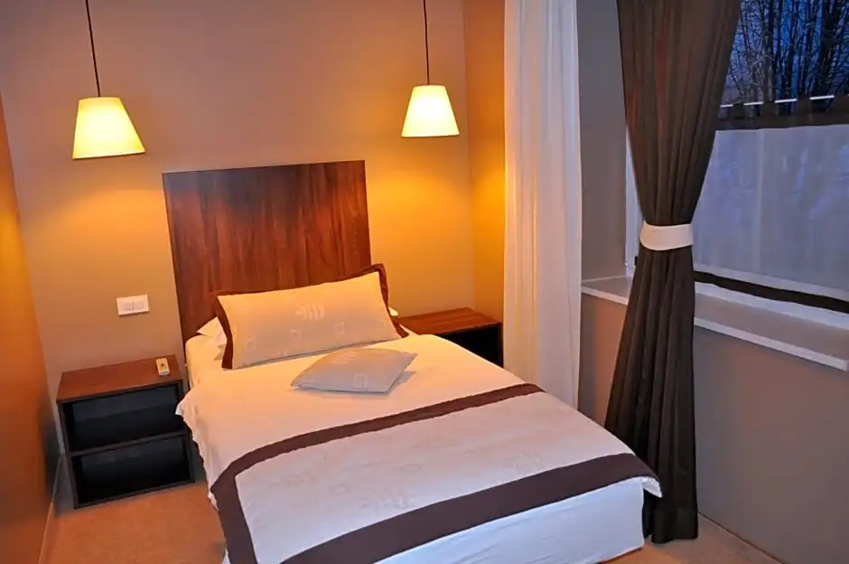 Ambient Hotel - Chambres
