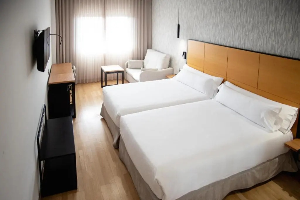Hotel Sercotel Gran Fama - Chambres