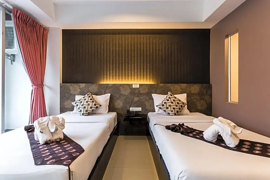 7Q Patong Beach Hotel - Tap to explore photos