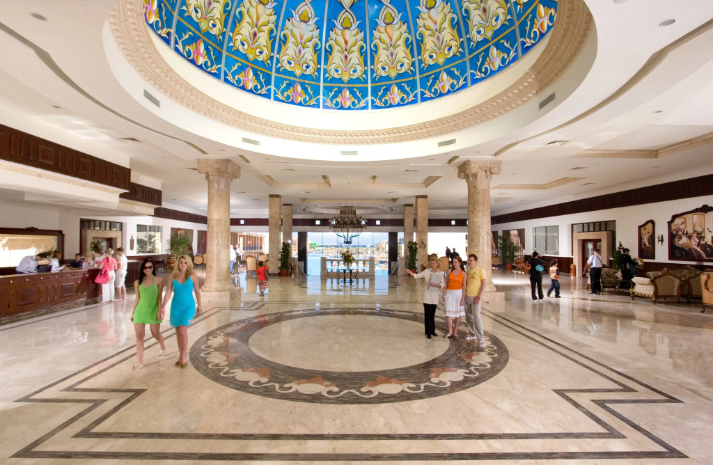 Titanic Beach - Families and Couples only: Grand hotel lobby with a reception desk, ornate ceiling dome, and polished marble floors.