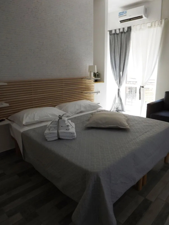 Deluxe Quadruple room with balcony