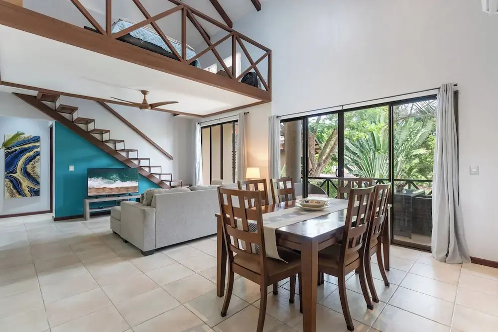 Modern Island-Themed Condo with Floor-to-Ceiling Windows & Garden and Pool Views Within Walking Distance of the Beach