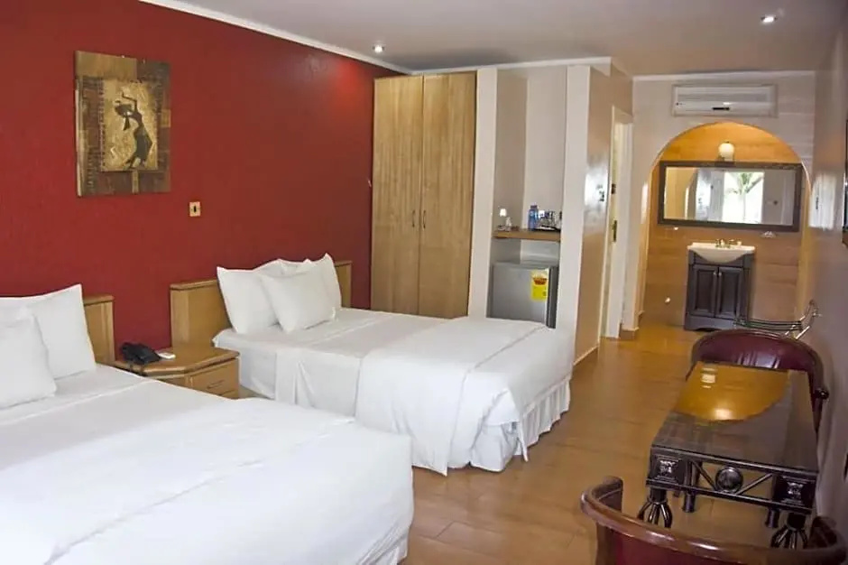 Tropical Enclave Hotel - Chambres