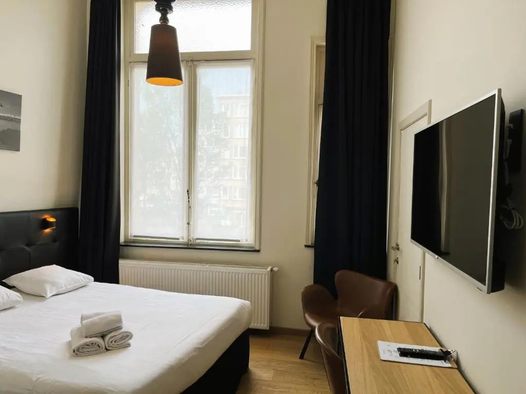 Le Parisien Hotel Bistro - Chambres