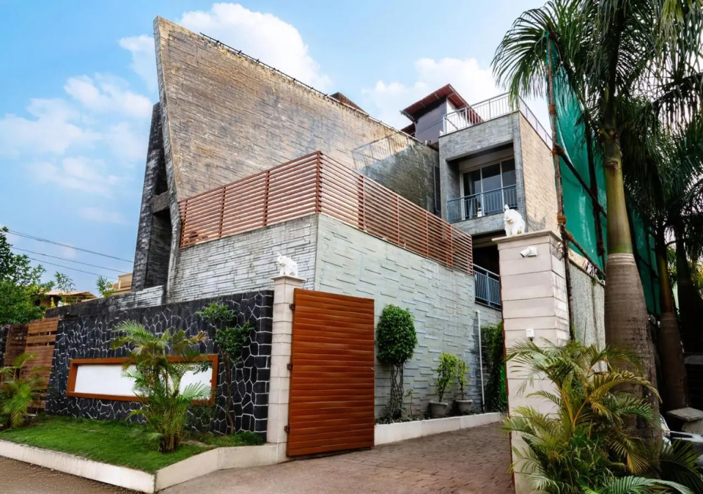 SaffronStays Urja, Lonavala - 3 BR Villa with 2 pools, spa room, jacuzzi, private elevator & waterfall
