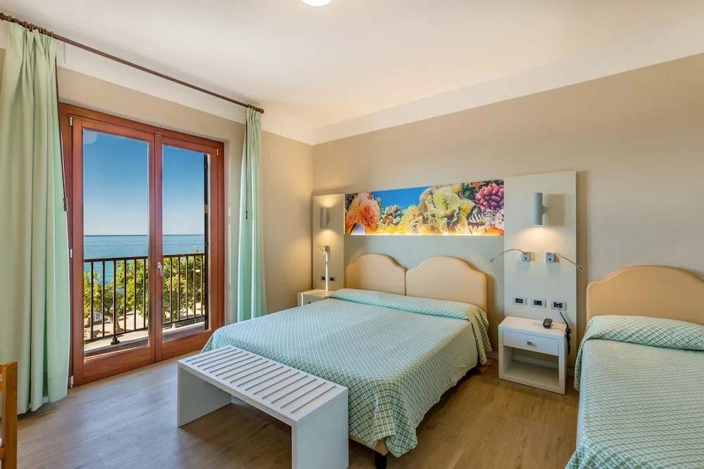 Superior Triple room with balcony and with sea view