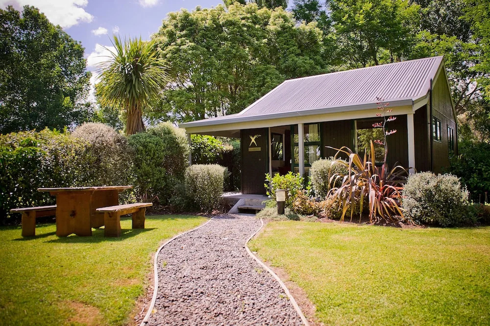 Cottage with balcony and with garden view