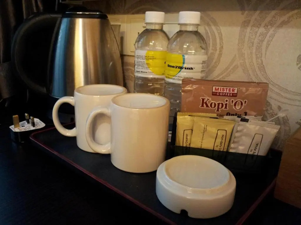 Capital O 91074 Grand World Hotel - Chambres
