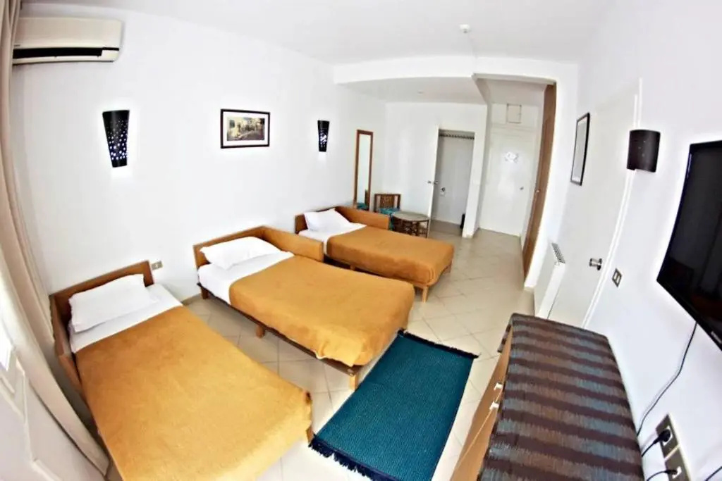 Standard Triple room with garden view