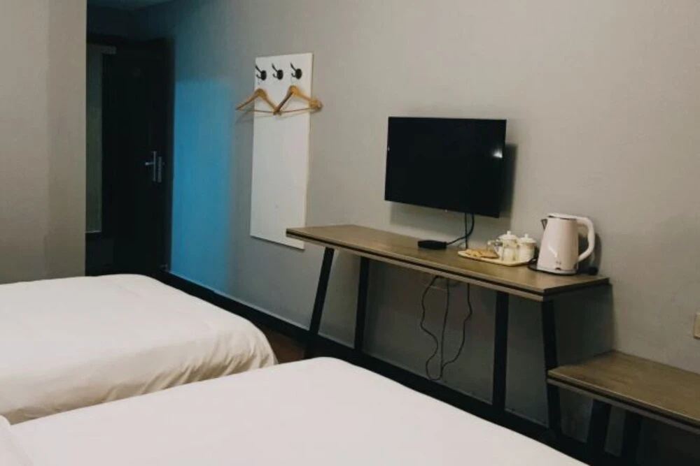 Taojiang Qijia Business Hotel