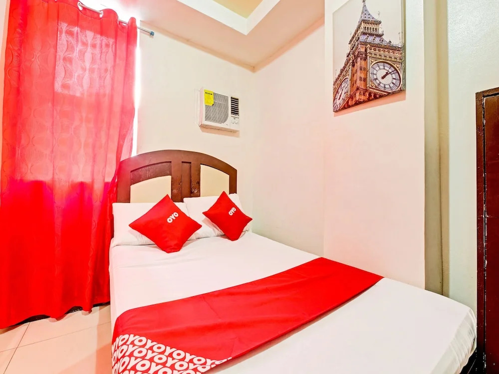 Четырёхместный семейный номер Standard 2 отдельные кровати в OYO 894 Cosmo Hotel P Campa Manila