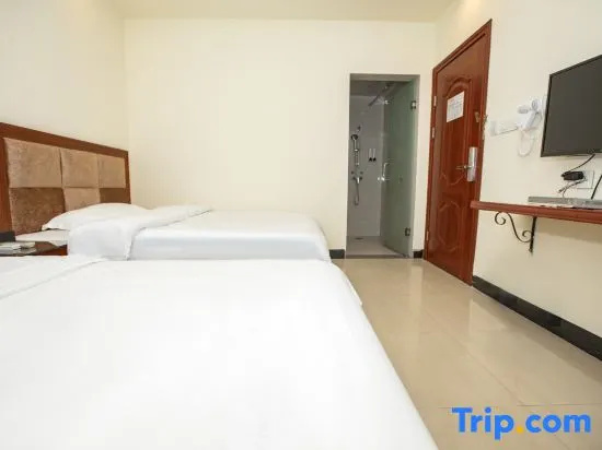 Huajun Hotel - Chambres