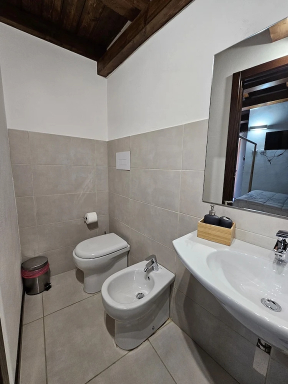 Deluxe Triple room with balcony and with courtyard view