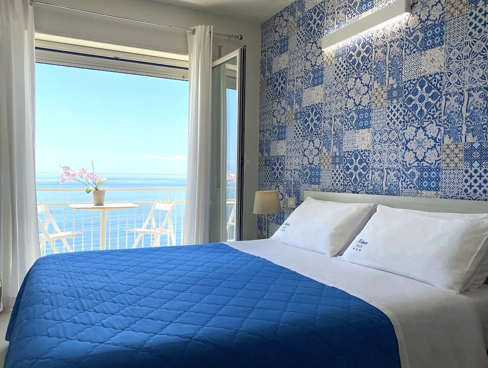 Standard Triple room with balcony and beachfront