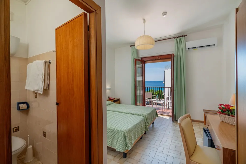Classic Triple room with balcony and with garden view